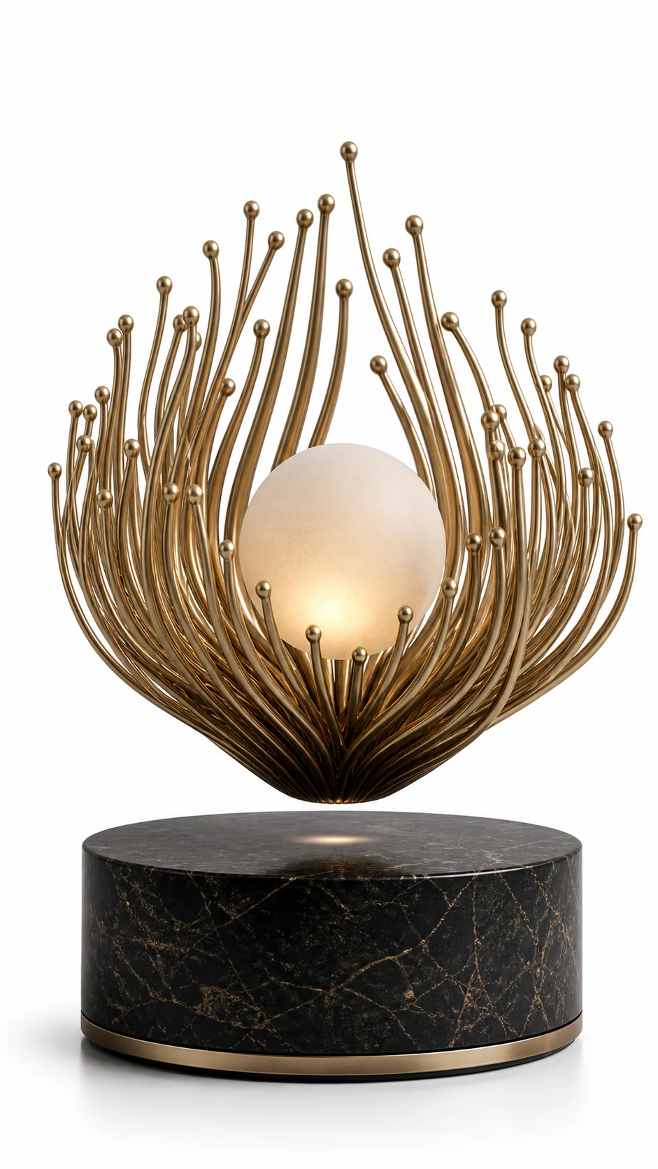 AMO Solstice Pearl Lamp with a glowing pearl-like center cradled by brushed gold filaments above a black marble-look base